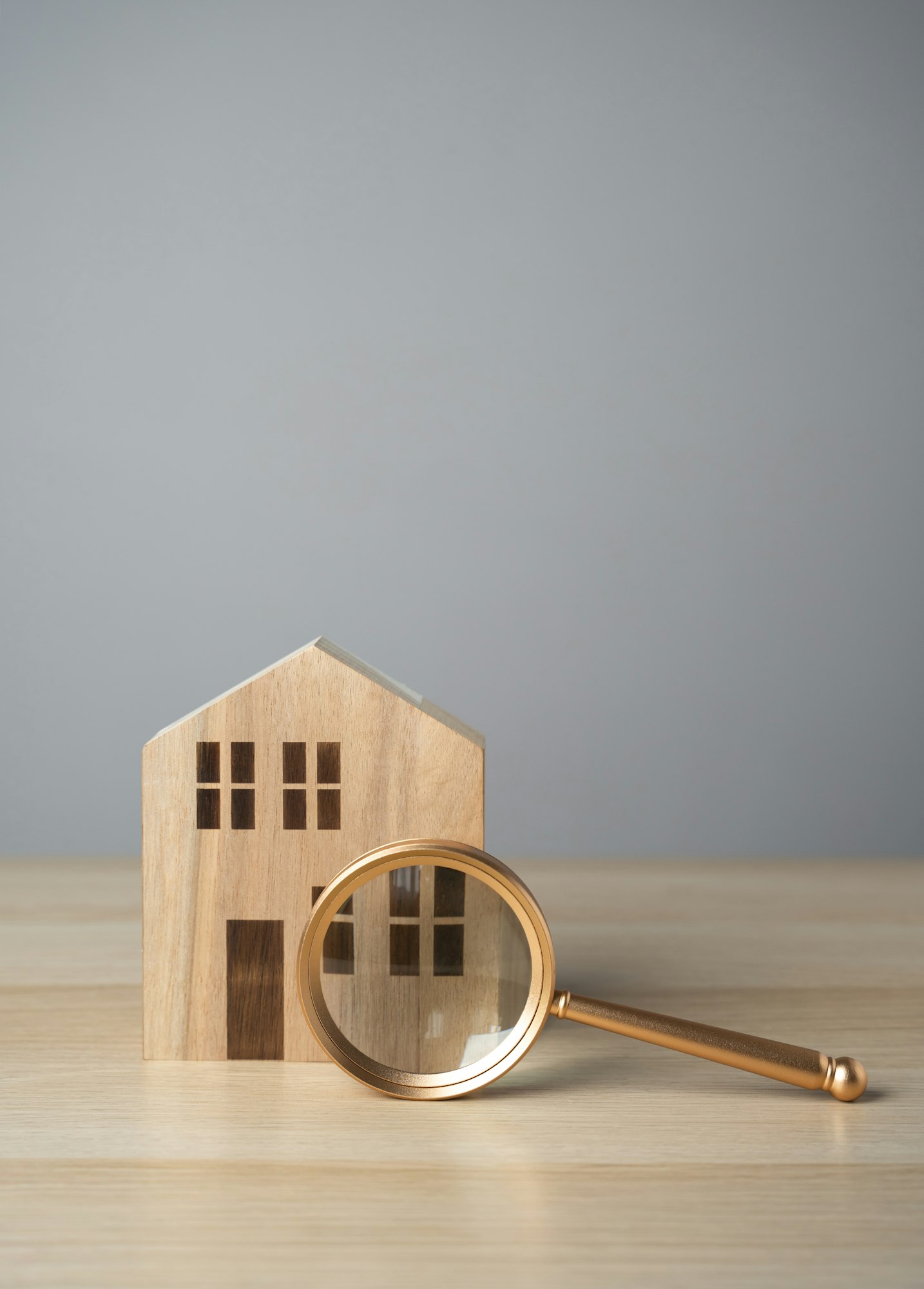 House and magnifying glass. Take a mortgage.